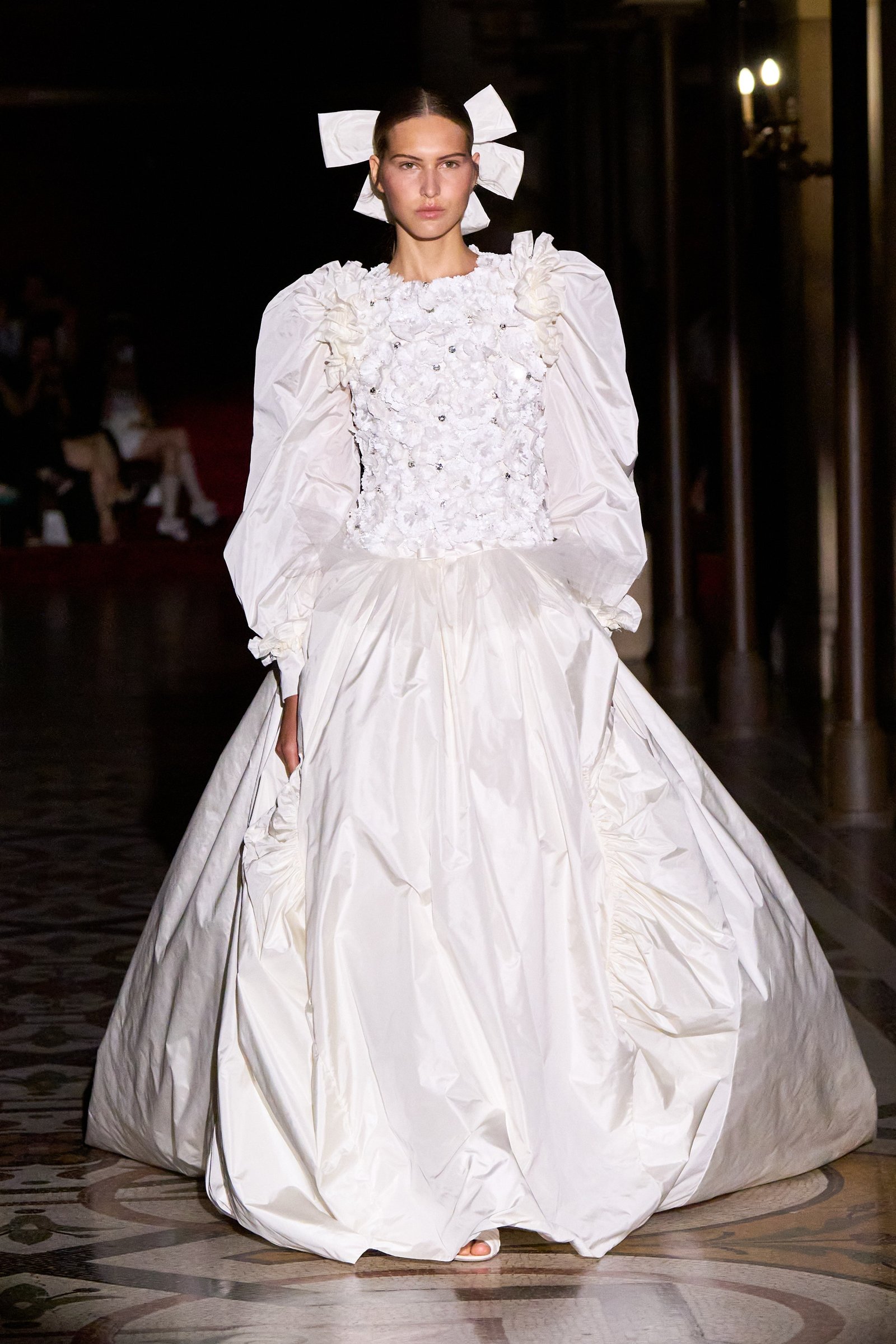 Image may contain Person Clothing Dress Fashion Formal Wear Gown Wedding Wedding Gown Adult and Lamp